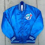 Blue jacket with a logo on a concrete surface in USA