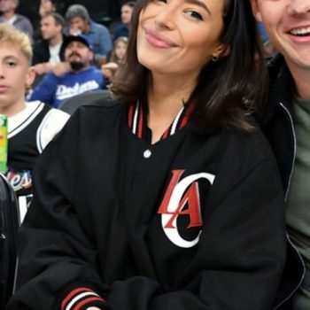 Person wearing a black jacket with 'LA' logo at a sports event