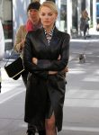 Margot Robbie black leather coat inspired by The Wolf of Wall Street.