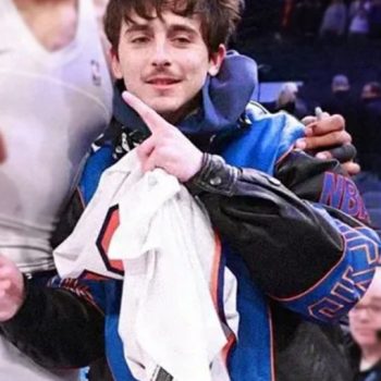 Person wearing a blue jacket with a white shirt underneath, pointing upwards.